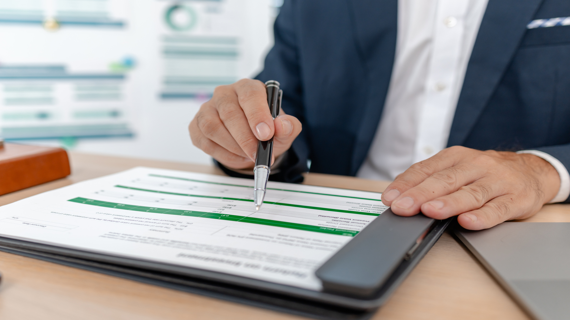 Bridging loan broker in Australia analysing property finance paperwork and loan calculations.
