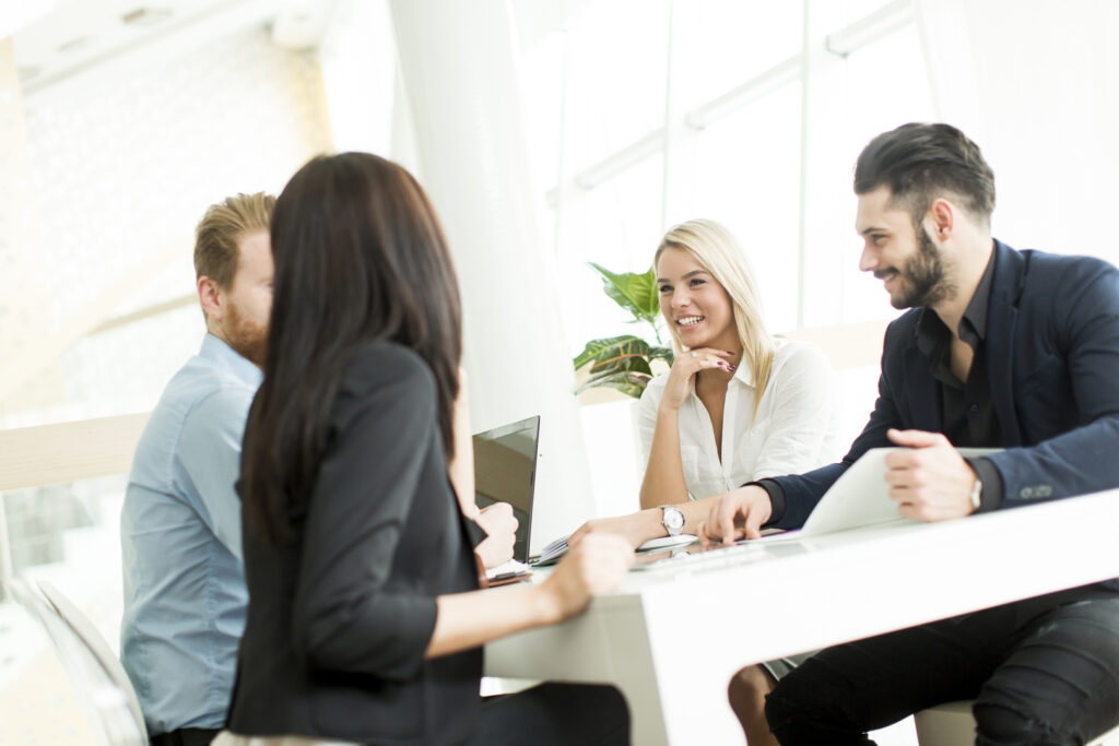Real estate agents discussing property listing details