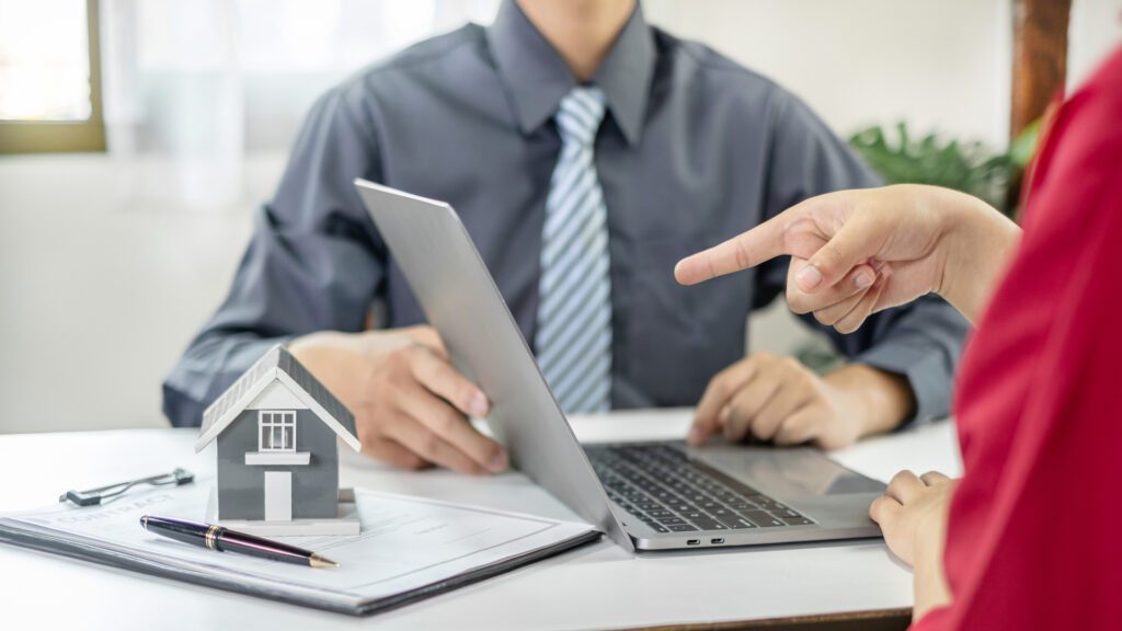 Homeowners reviewing loan strategy with property finance expert