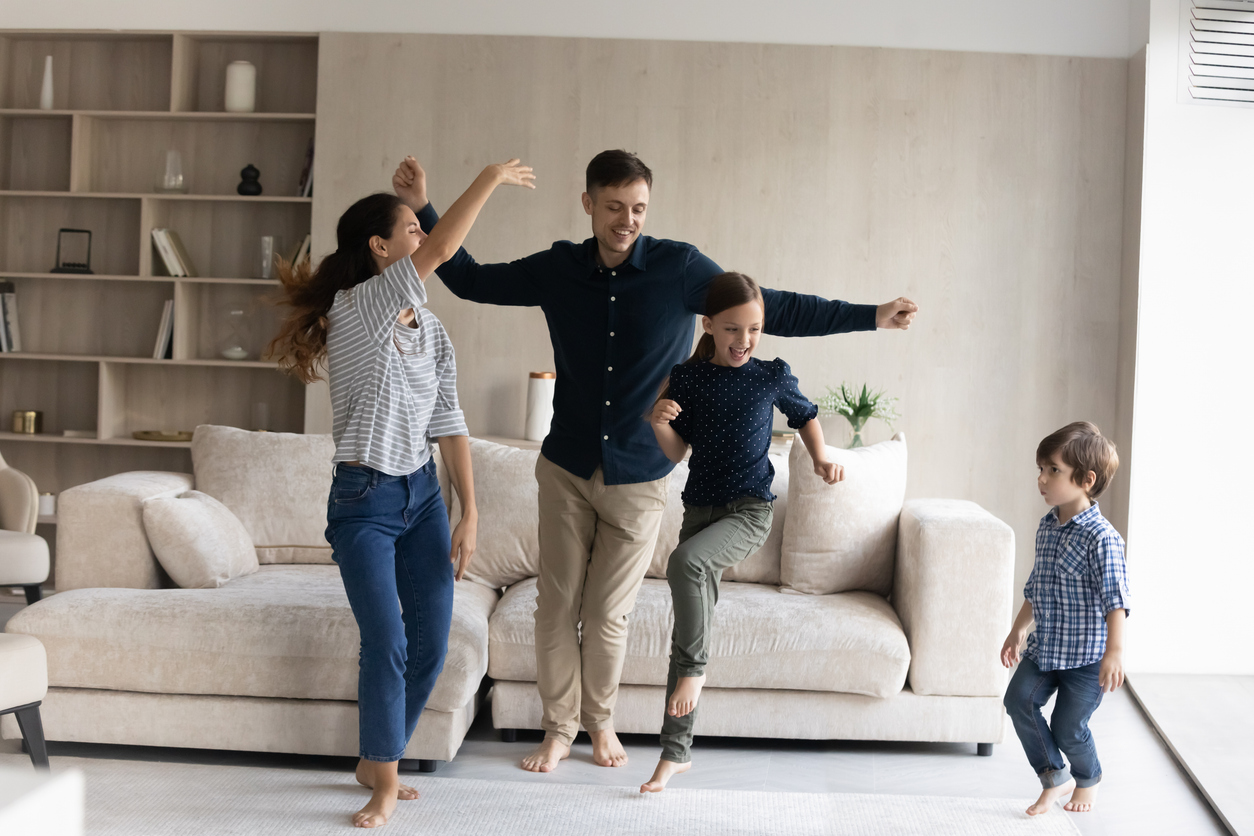 Family celebrating in their new home after securing a bridging loan in Brisbane