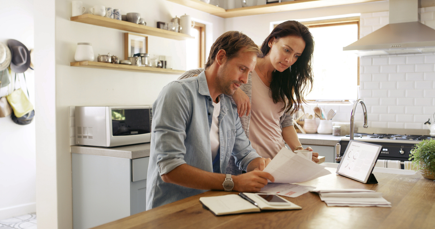 Homeowners calculating equity and income before applying for a bridging loan in Hobart, Tasmania.