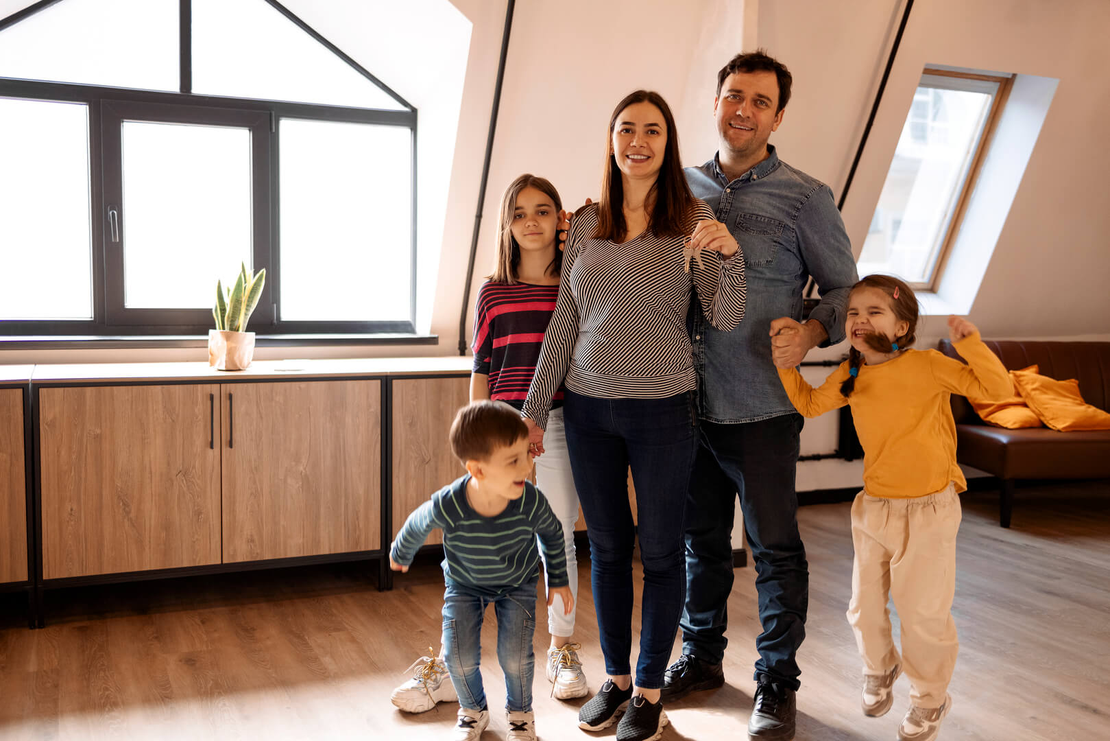 Sydney family celebrating in their new home after securing a bridging loan to buy before selling.
